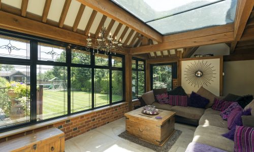 54160,Cushioned benches in sunny conservatory