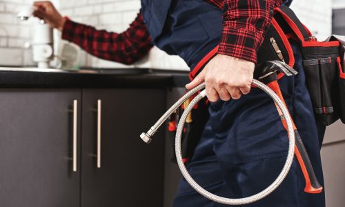 New plumbing. Close-up of foreman checking all things before start faucet